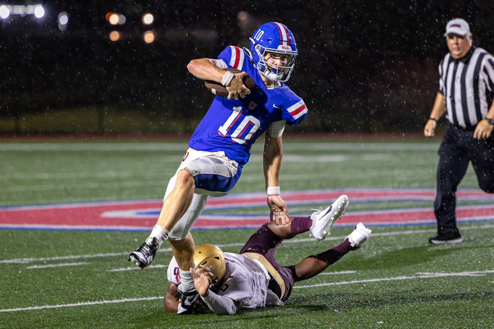 <strong>Brady Hughes (10) of the MUS Owls runs with the ball against Julius Fletcher (6) of the Melrose Wildcats during the first half at Memphis University School Aug. 30.</strong> (Wes Hale/Special to The Daily Memphian)