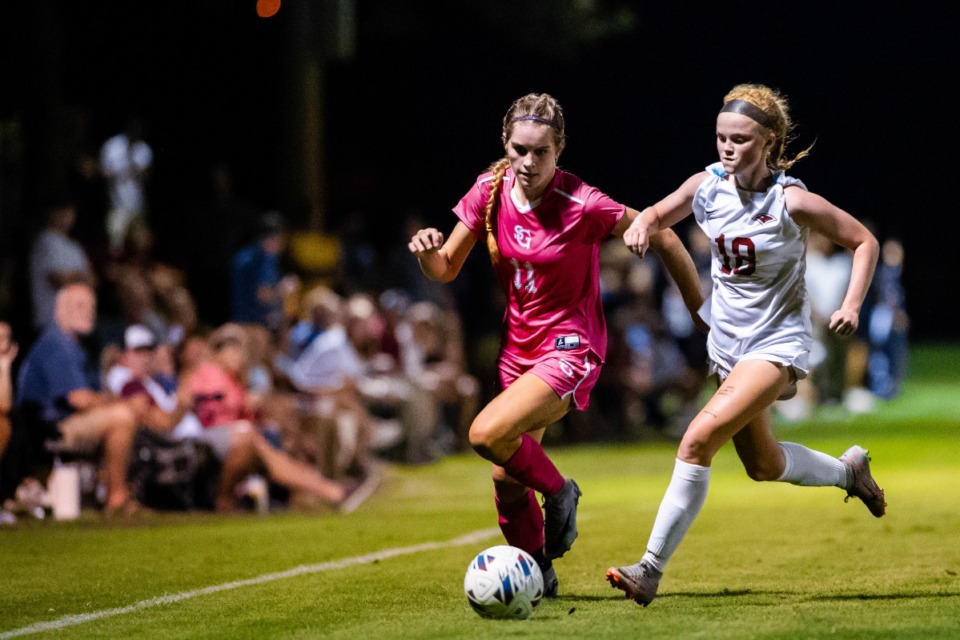 <strong>St. George's Elle Weathersby controls the ball while being chased by ECS freshman Ellie Metcalf during the match at St. George&rsquo;s on Thursday, Sept. 5.</strong> (Benjamin Naylor/The Daily Memphian)