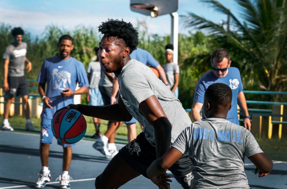<strong>Memphis Tigers player James Wiseman shows off his dribbling skills during a basketball camp with local youth in the Bozine Town area of Nassau, Bahamas,&nbsp; Aug. 16, 2019.</strong> (Mark Weber/Daily Memphian)