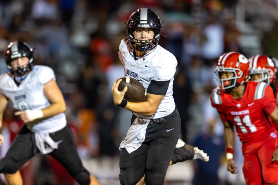 <strong>Houston quarterback Chandler Day (15) runs for the winning touchdown against Germantown High on Friday, Sept. 6, 2024.</strong> <strong>Day&rsquo;s last-second heroics led the Mustangs to a 36-30 win over the Red Devils.&nbsp;</strong>(Wes Hale/Special to The Daily Memphian)