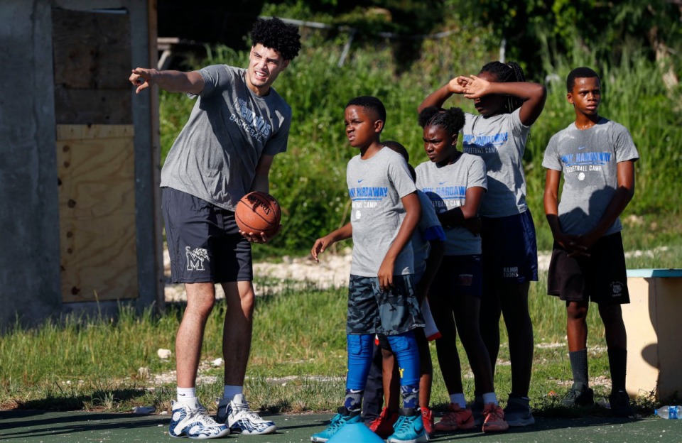 <strong>Memphis Tigers players Isaiah Maurice (left) directs local youth during a basketball camp in the Bozine Town area of Nassau, Bahamas, Aug. 16, 2019.</strong> (Mark Weber/Daily Memphian)