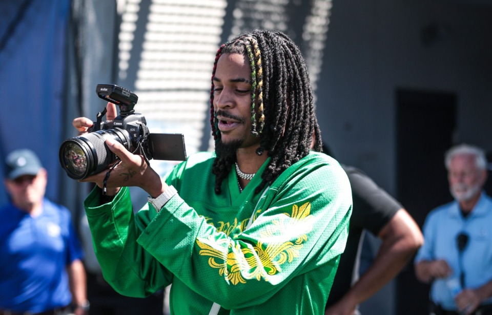 <strong>Ja Morant tries his hand a videography during a Sept. 7, 2024 University of Memphis game against Troy.</strong> (Patrick Lantrip/The Daily Memphian)