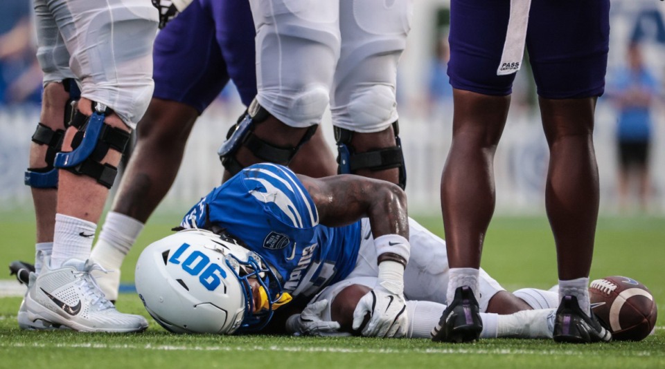 <strong>University of Memphis running back Sutton Smith (5) holds his knee after going down during an Aug. 31, 2024 game against North Alabama.</strong> (Patrick Lantrip/The Daily Memphian)