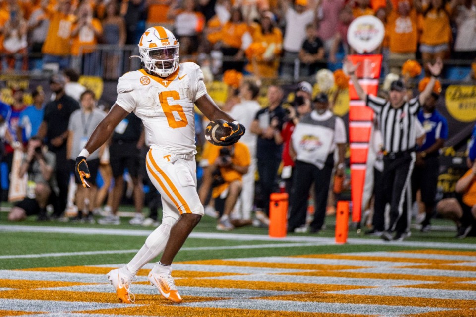 <strong>Tennessee Volunteers running back Dylan Sampson (6) scores against the North Carolina State Wolfpack during the first half of an NCAA football game Saturday, Sept. 7, 2024, in Charlotte, N.C.</strong> (Scott Kinser/AP)