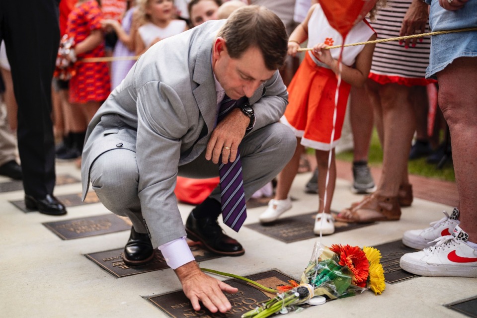 <strong>Clemson head coach Dabo Swinney stops to pay his respects to former Clemson player Diondre Overton while walking to the stadium before an NCAA college football game against Appalachian State, Saturday, Sept. 7, 2024, in Clemson, S.C.</strong> (AP Photo/Jacob Kupferman)