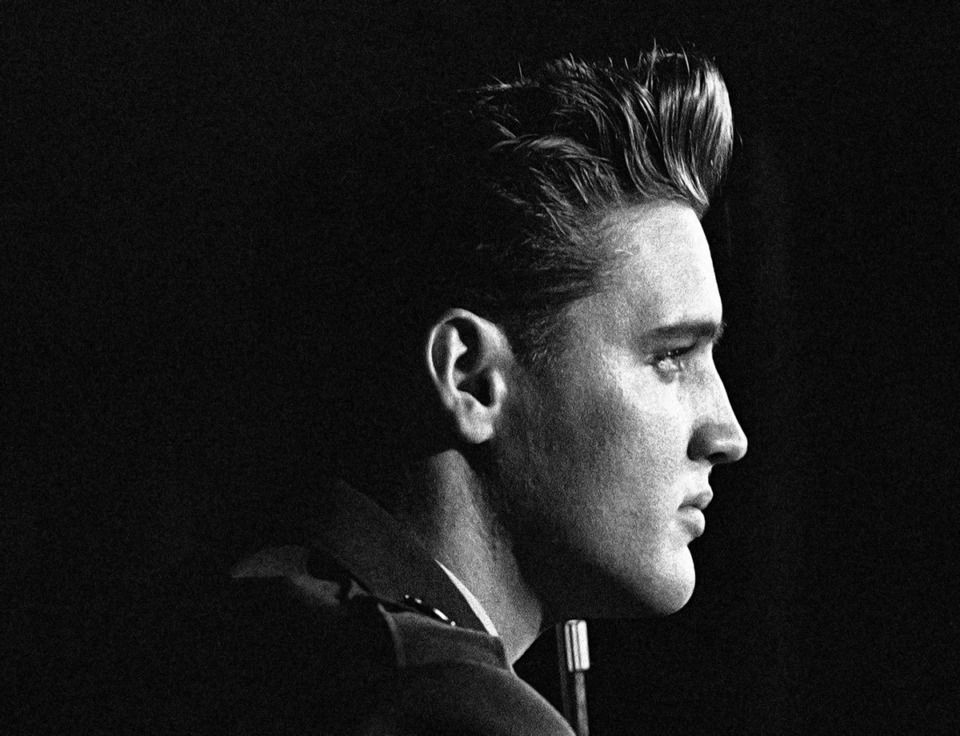 <strong>Elvis Presley makes the top 21 of &ldquo;The Essential Memphis&rdquo; Library twice. Presley is shown here during a press conference on March 1, 1960 in Friedberg, Germany as he was discharged after two years of military service.</strong> (Walter Lindlar/AP Photo file)