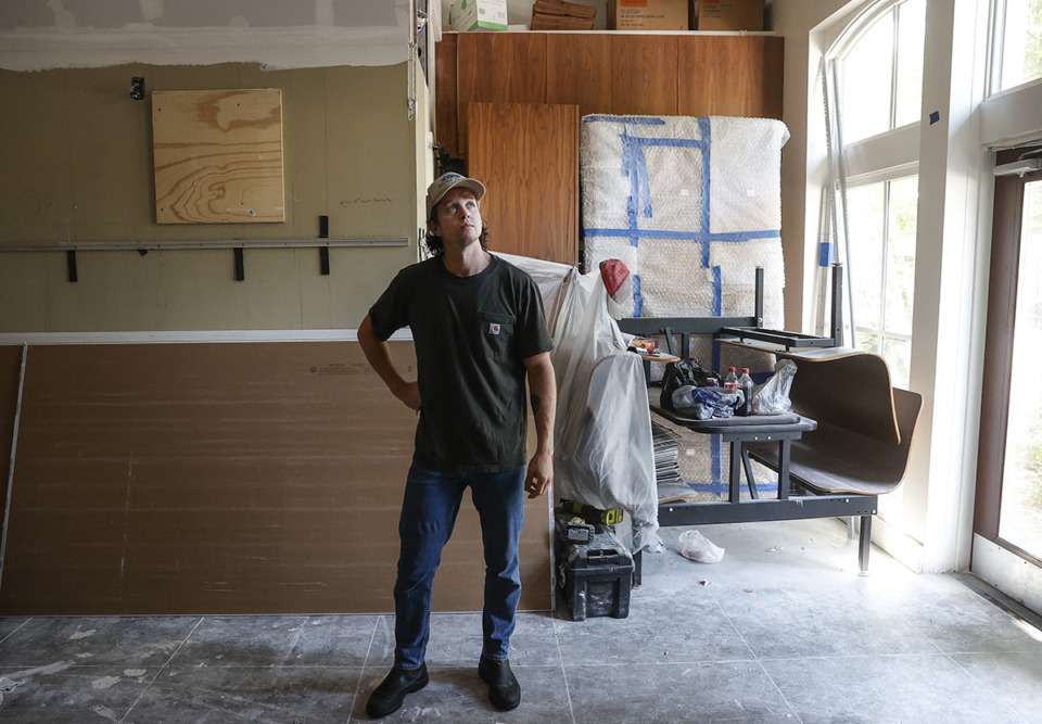 <strong>Kinfolk owner Cole Jeanes surveys construction of his restaurant as renovations continues after the building was flooded due to a water leak.</strong> (Mark Weber/The Daily Memphian)