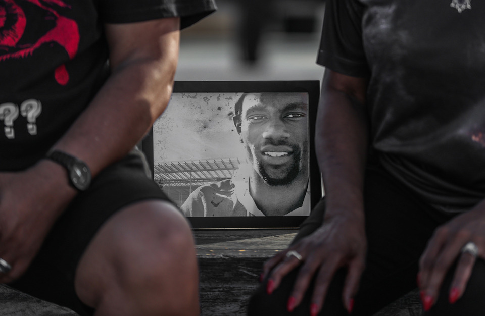 <strong>A framed picture of Tyre Nichols sits between his parents, RowVaughn and Rodney Wells at Raleigh Springs Skate part on what would have been her son's 31st birthday June 5, 2024.</strong> (Patrick Lantrip/The Daily Memphian file)