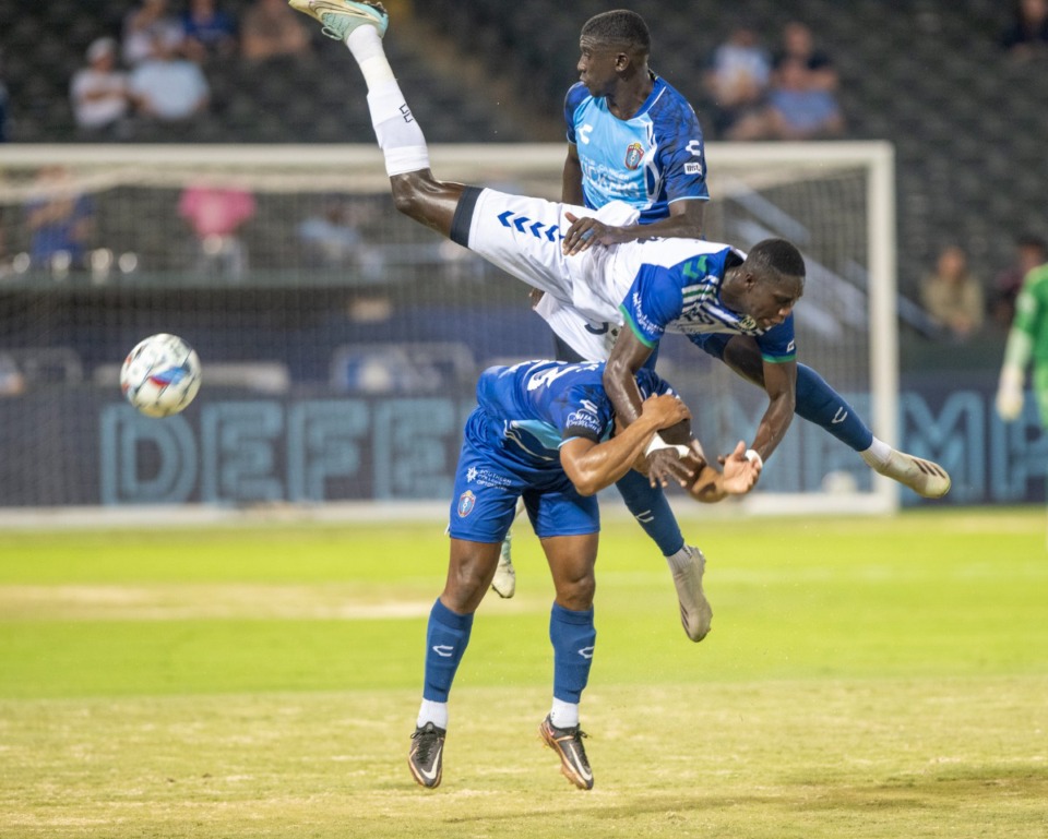 <strong>Hartford's Manadou Dieng becomes airborne trying to defend against Memphis' Leston Paul and Abdoulaye Cissoko in Wednesday's match at AutoZone Park.</strong> (Greg Campbell/Special to The Daily Memphian)