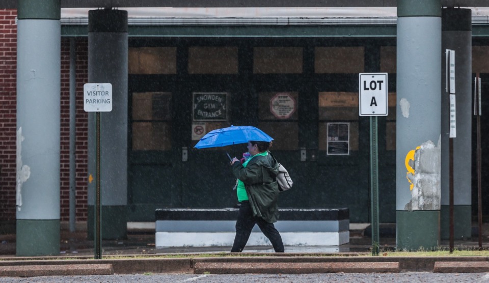 <strong>A teacher leaves Snowden Elementary School Sept. 12, 2024 after getting let out for inclement weather.</strong> (Patrick Lantrip/The Daily Memphian)