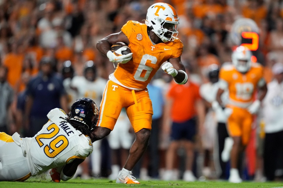 <strong>Tennessee running back Dylan Sampson (6) runs the ball past Kent State defensive back Armahn Hale (29) during the first half of an NCAA college football game Saturday, Sept. 14, 2024, in Knoxville, Tenn.</strong> (George Walker IV/AP)