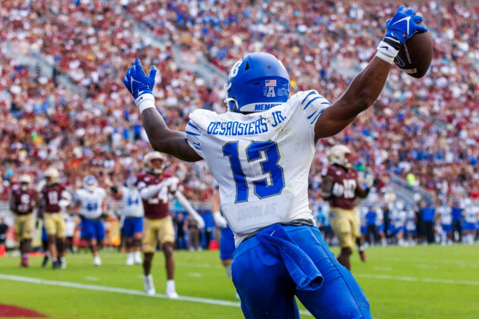 <strong>Memphis running back Greg Desrosiers Jr. (13) celebrates scoring his team's first touchdown against Florida State Saturday, Sept. 14, 2024, in the Tigers&rsquo; big win in Tallahassee, Fla.</strong> (Colin Hackley/AP file)