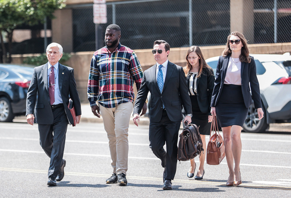 <strong>Flanked by his attorneys, former Memphis Police Department officer Emmitt Martin walks into the Odell Horton Federal Building Aug. 23.</strong> (Patrick Lantrip/The Daily Memphian)