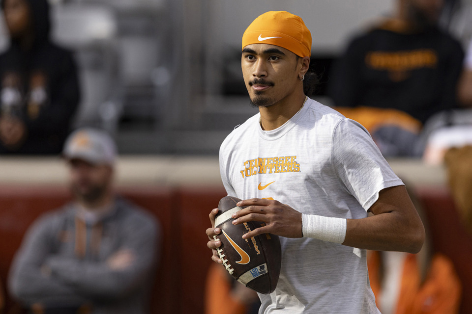 <strong>Tennessee quarterback Nico Iamaleava (8) throws to a receiver during warmups before an NCAA college football game against Vanderbilt Saturday, Nov. 25, 2023, in Knoxville, Tenn.</strong> (Wade Payne/AP file)