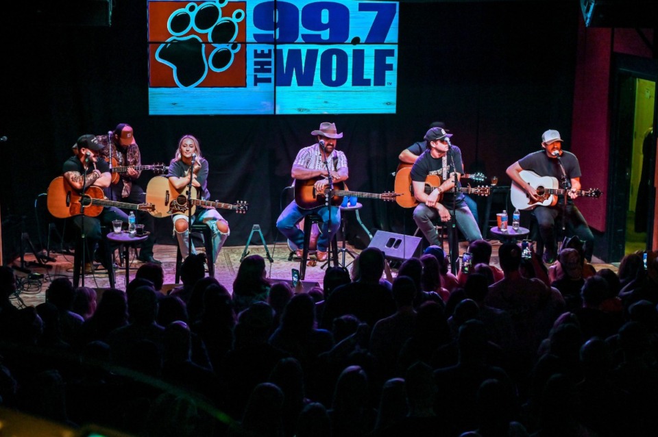 <strong>99.7 The Wolf personalities StyckMan, Erin Austin, Duane and Abby on stage welcoming the crowd to the Stars and Guitars show at Lafayette's Music Room.</strong> (Courtesy Steve Roberts)