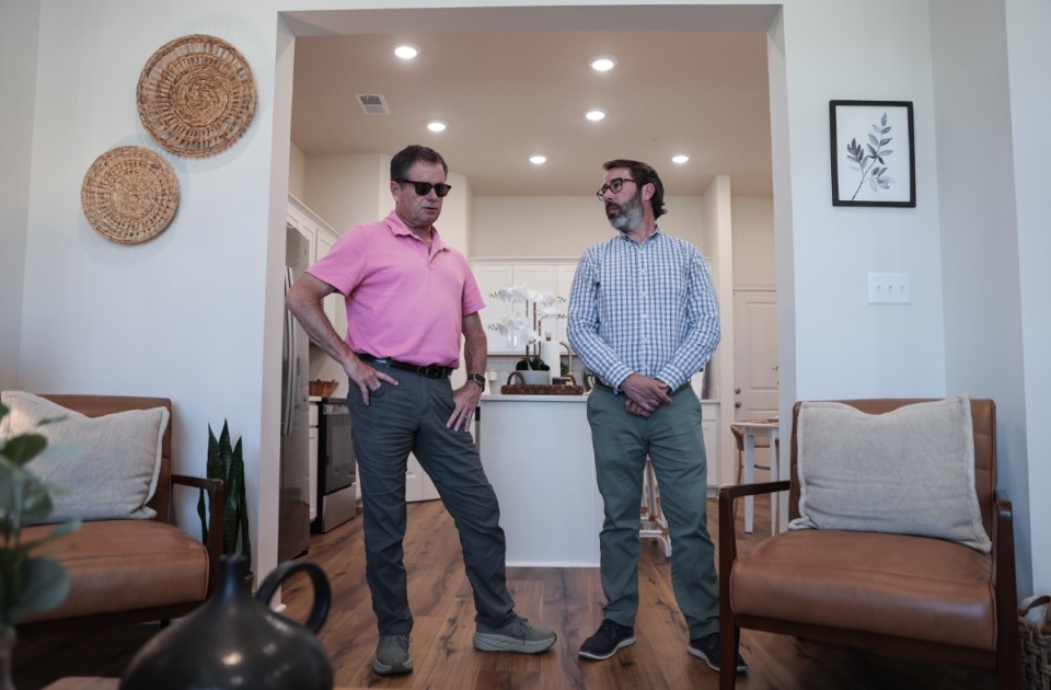 <strong>John Porter (left) and Austin Duffie give a tour of a model home at The Villages at Shelby Station, a new townhome development in Collierville on Houston Levee, on Sept. 17, 2024.</strong> (Patrick Lantrip/The Daily Memphian)