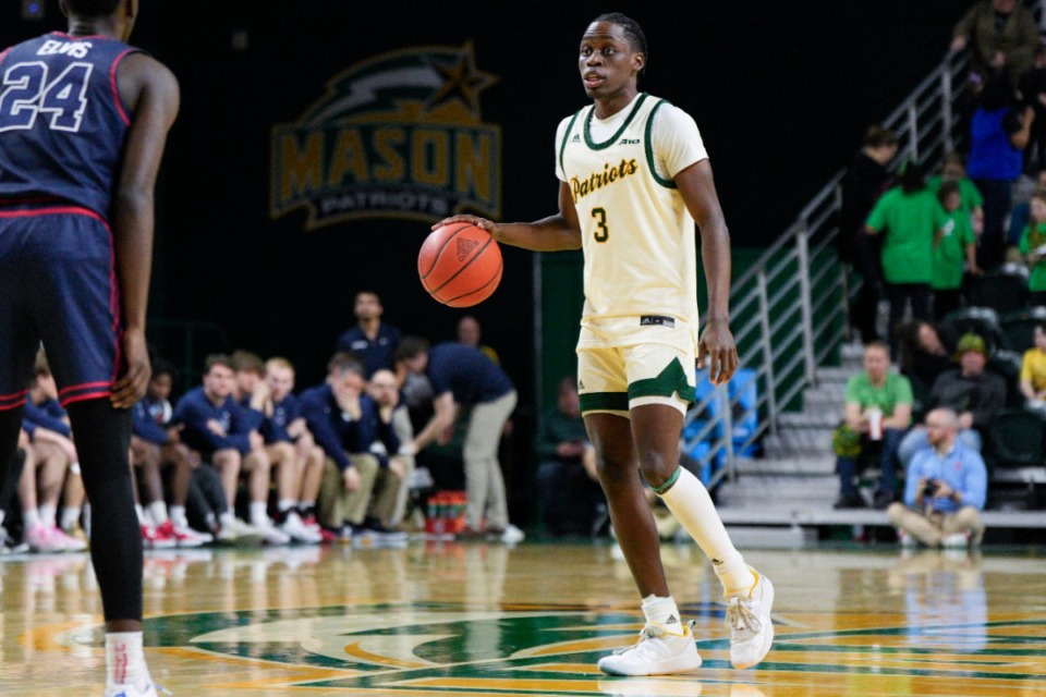 George Mason guard Baraka Okojie (3) dribbles the ball during the second half of an NCAA college basketball game against Dayton, Wednesday, Feb. 21, 2024, in Fairfax, Va. George Mason won 71-67. (AP Photo/Jess Rapfogel)