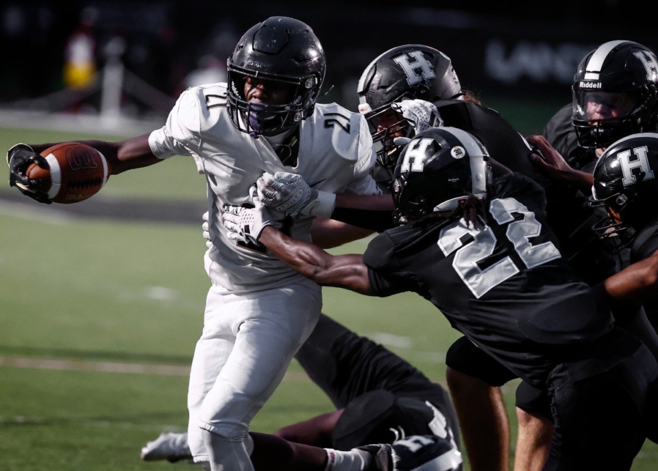 <strong>Whitehaven running back Christopher Talley (left) makes a run against the Houston defense on Friday, Sept. 20, 2024.</strong> (Mark Weber/The Daily Memphian)