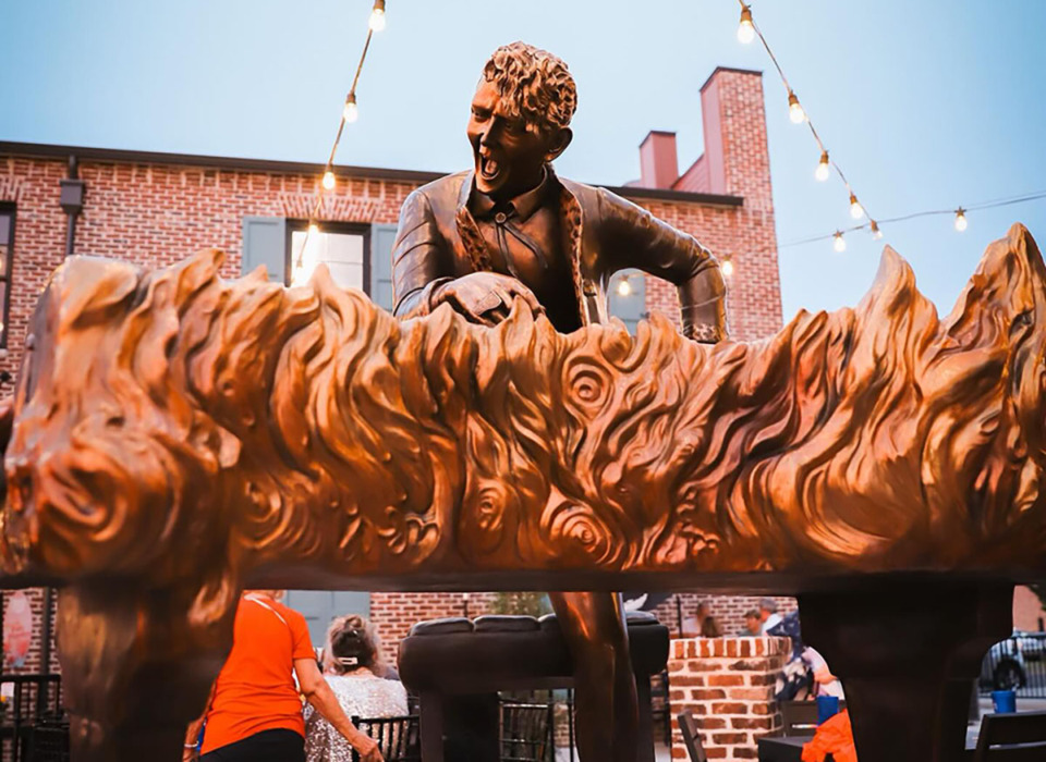 <strong>The statue is surrounded by bricks purchased by fans around the world prior to the unveiling. Some are dedicated to a specific person, some just quote Lewis&rsquo; song lyrics.</strong> (Courtesy Savannah Smith/Silo Square)