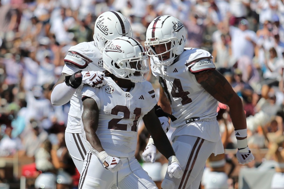 <strong>Mississippi State running back Davon Booth (21) celebrates his touchdown run with teammate Mississippi State tight end Justin Ball (84) against Florida during the first half of an NCAA college football game in Starkville, Miss., Saturday, Sept. 21, 2024.</strong> (James Pugh/AP)