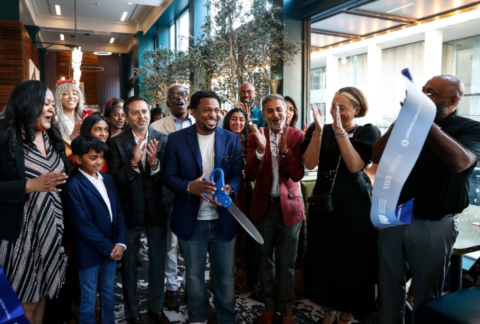 <strong>Chef Dewayne Levy (middle) cuts a ribbon during a sneak peek of The Archives restaurant in the Hotel Napoleon on Wednesday, Sept. 18.</strong> (Mark Weber/The Daily Memphian)