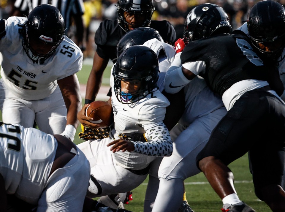 <strong>Whitehaven quarterback Jaden Thomas (middle) scores against Houston during action on Friday, Sept. 20, 2024.</strong> (Mark Weber/The Daily Memphian)