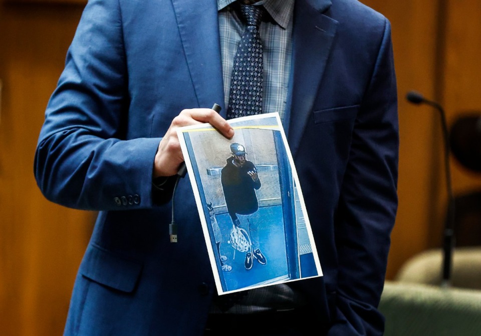 <strong>Paul Hagerman, Shelby County deputy district attorney, shows the jury a photo of defendant Justin Johnson during the murder trial of rapper Young Dolph in Memphis, Monday, Sept. 23, 2024.</strong> (Mark Weber/Daily Memphian)