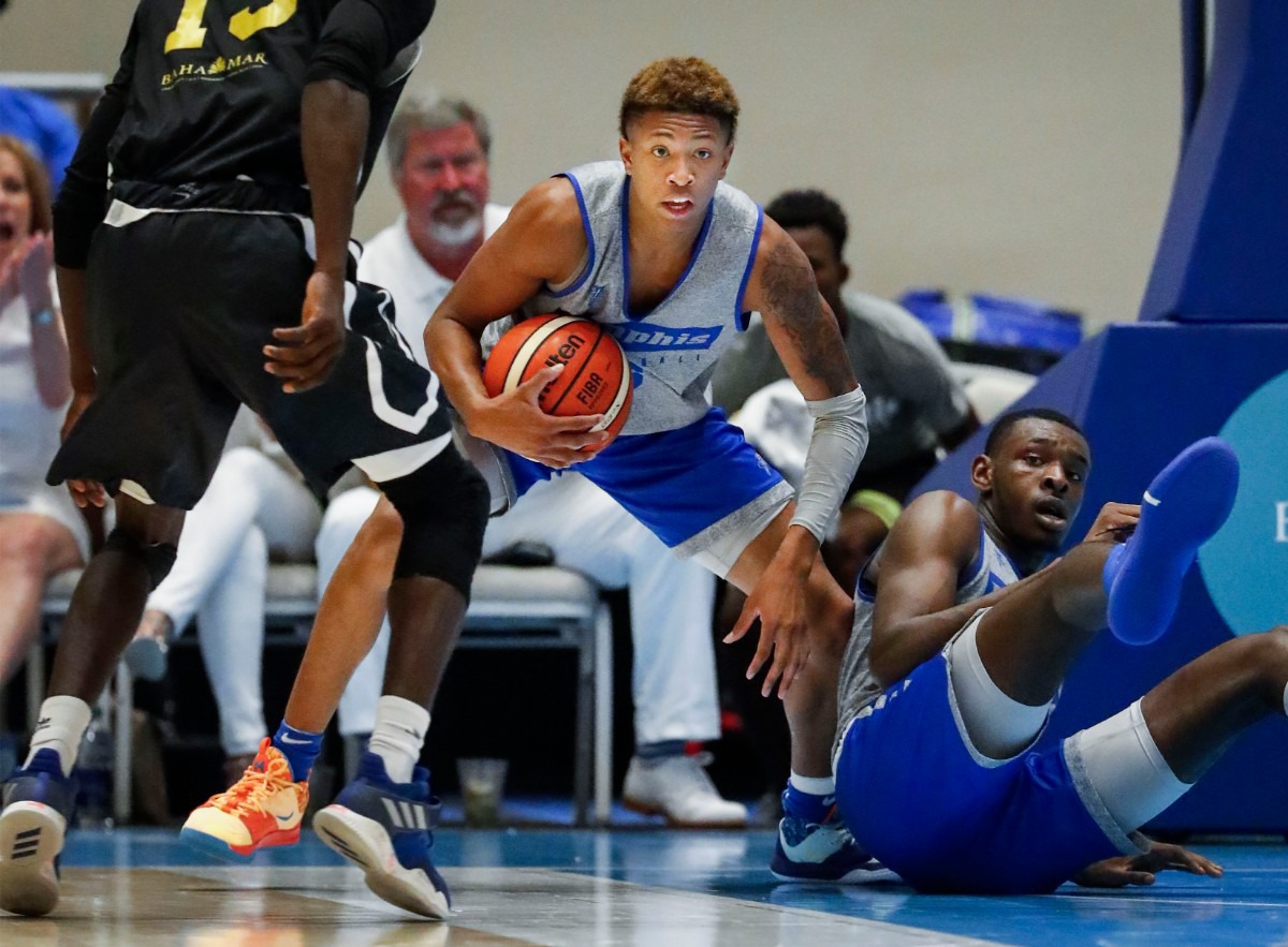 <strong>Memphis Tigers guard Boogie Ellis grabs a rebound as teammate Lance Thomas (right) looks on during action against the Bahamas National Team in their exhibition game in Nassau, Bahamas, Saturday, August 17, 2019.</strong> (Mark Weber/Daily Memphian)