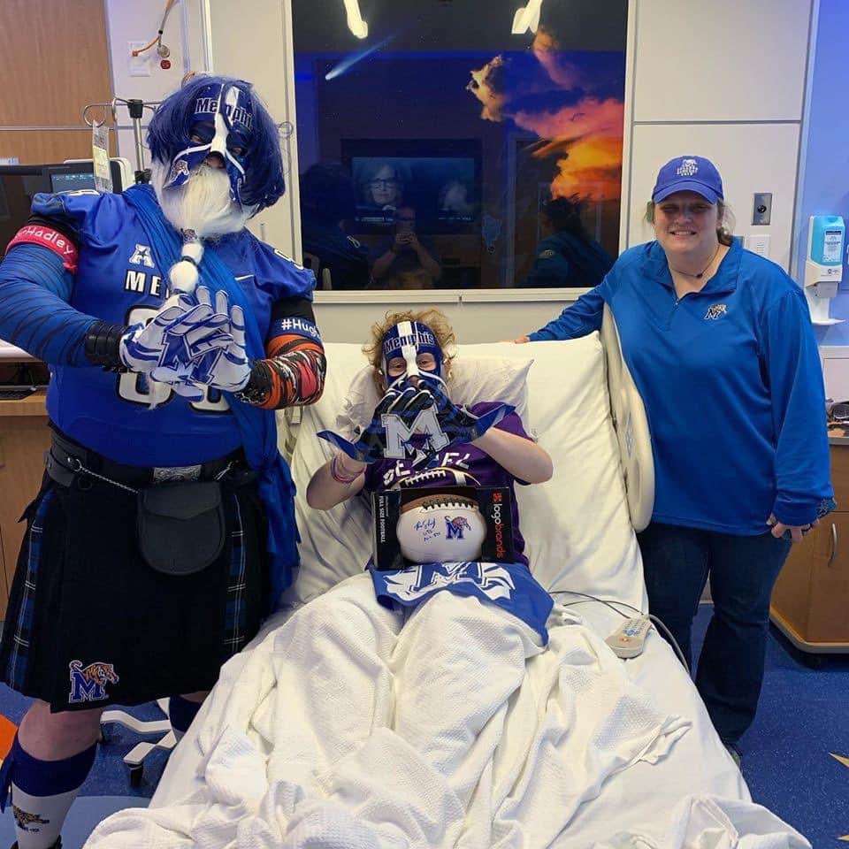 <strong>From left to right: Phil Glass (The Ultimate Tiger) visits Jackson Hughey, center, in the hospital along with fellow Tiger fan Sherrie Hopper.</strong> (Courtesy Phil Glass)