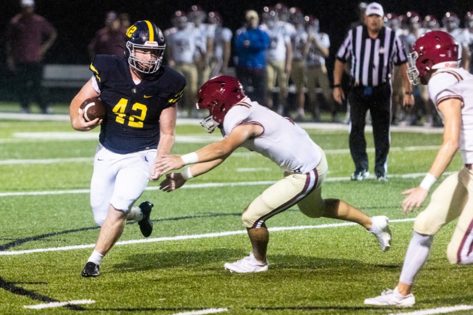 <strong>Lausanne&rsquo;s Levi Dorsey runs with the ball after a missed snap during Friday's ECS at Lausanne football game.</strong> (Brad Vest/Special to The Daily Memphian)