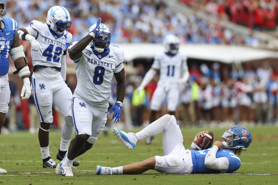 <strong>Kentucky defensive lineman Octavious Oxendine (8) reacts after sacking Mississippi quarterback Jaxson Dart (2) during the first half of an NCAA college football game against Ole Miss Sept. 28 in Oxford.</strong> (Randy J. Williams/AP file)