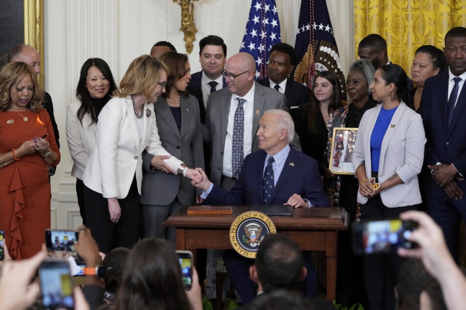 <strong>Former U.S. Rep. Gabby Giffords speaks with President Joe Biden during an event with Vice President Kamala Harris and others in the East Room of the White House in Washington Sept. 26 about gun violence in the United States.</strong> (Susan Walsh/AP file)