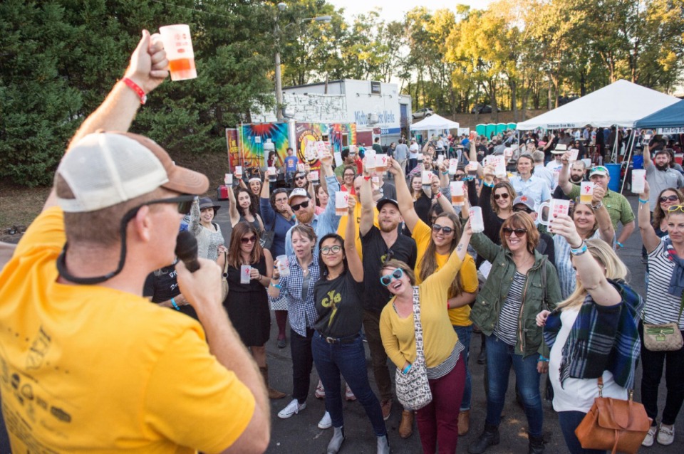 <strong>Josh Spickler toasts festival-goers at the 2016 Cooper-Young Beerfest.&nbsp;The festival returns for its 14th year on Saturday, Oct. 19.</strong> (Brandon Dill/Courtesy&nbsp;Cooper-Young Beerfest)