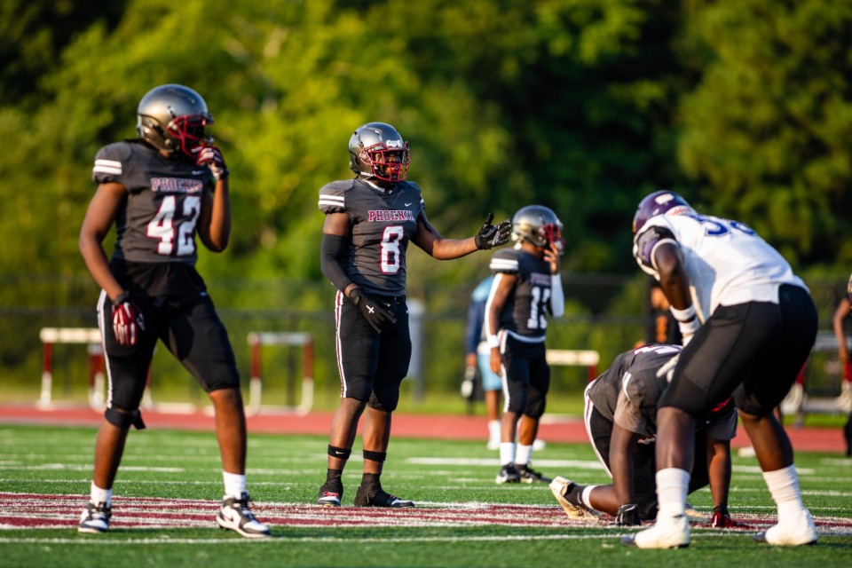 <strong>Stanley Burrow (#8) from MASE football looks to the line of scrimage during MASE's scrimage against Collierville Aug. 9.</strong> (Benjamin Naylor/The Daily Memphian file)