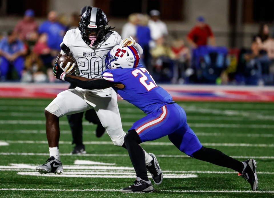 <strong>Houston running back Celley Davis (left) is tackled by Bartlett defender Brandon Whitehead on Friday, Oct. 4, 2024.</strong> (Mark Weber/The Daily Memphian)