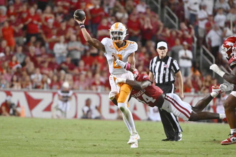 <strong>Tennessee quarterback Nico Iamaleava (8) throws under pressure from Arkansas linebacker Stephen Dix Jr. (14) during the first half of an NCAA college football game, Saturday, Oct. 5, 2024, in Fayetteville, Ark.</strong> (Michael Woods/AP)