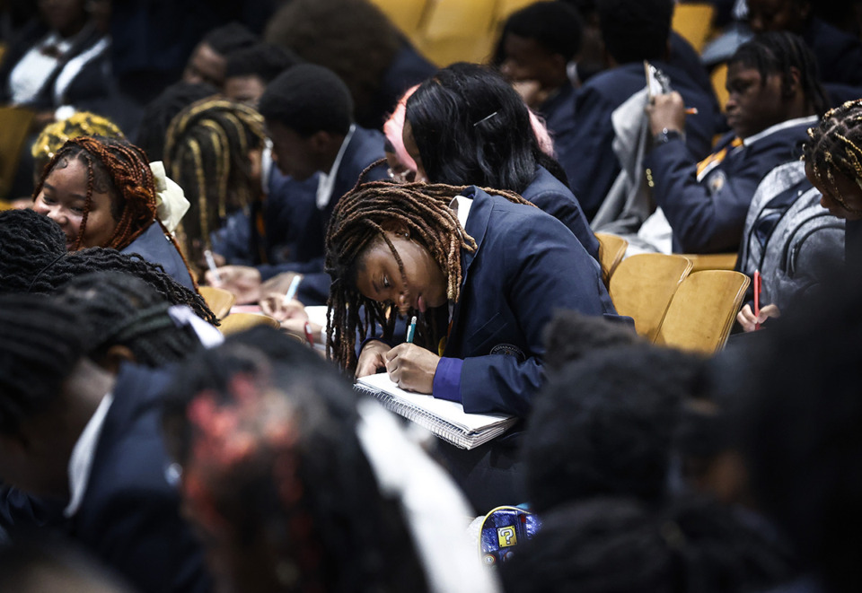 <strong>Freedom Preparatory Academy high school students write down questions during an event with author Valeria Luiselli Wednesday, Oct. 2.</strong> (Mark Weber/The Daily Memphian)