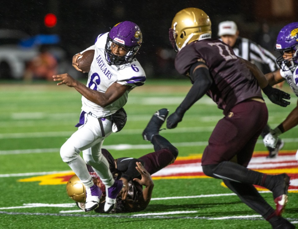 <strong>Southwind running back Gary Greer is runs by Melrose Julius Fletcher to make a short gain in the wet cross county contest at Melrose High School Sept. 27, 2024.</strong> (Greg Campbell/Special for The Daily Memphian file)&nbsp;