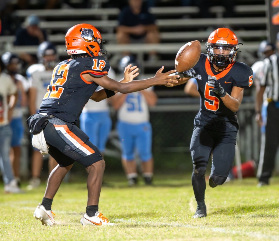 <strong>Fairley High School quarterback Andrew Johnson tosses the ball to running back Anquan Richmond for a large gain against Northpoint Christian, Friday, Sept. 20. Fairley went on to win and remain unbeaten 12-7 over Northpoint Christian.</strong> (Greg Campbell/Special to The Daily Memphian)