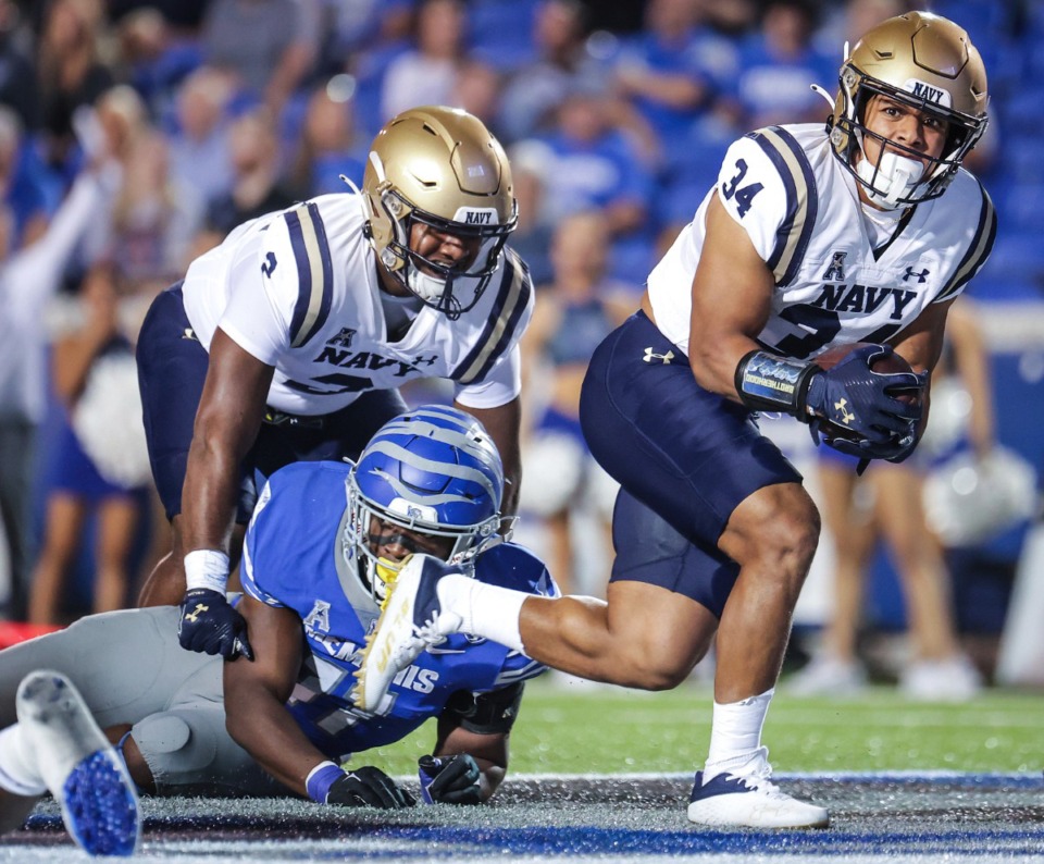 <strong>Navy running back Anton Hall Jr. (34) scores a touchdown against Memphis on Thursday, Sept. 14, 2023. The Midshipmen received votes in the AP poll.</strong> (Patrick Lantrip/The Daily Memphian via AP)