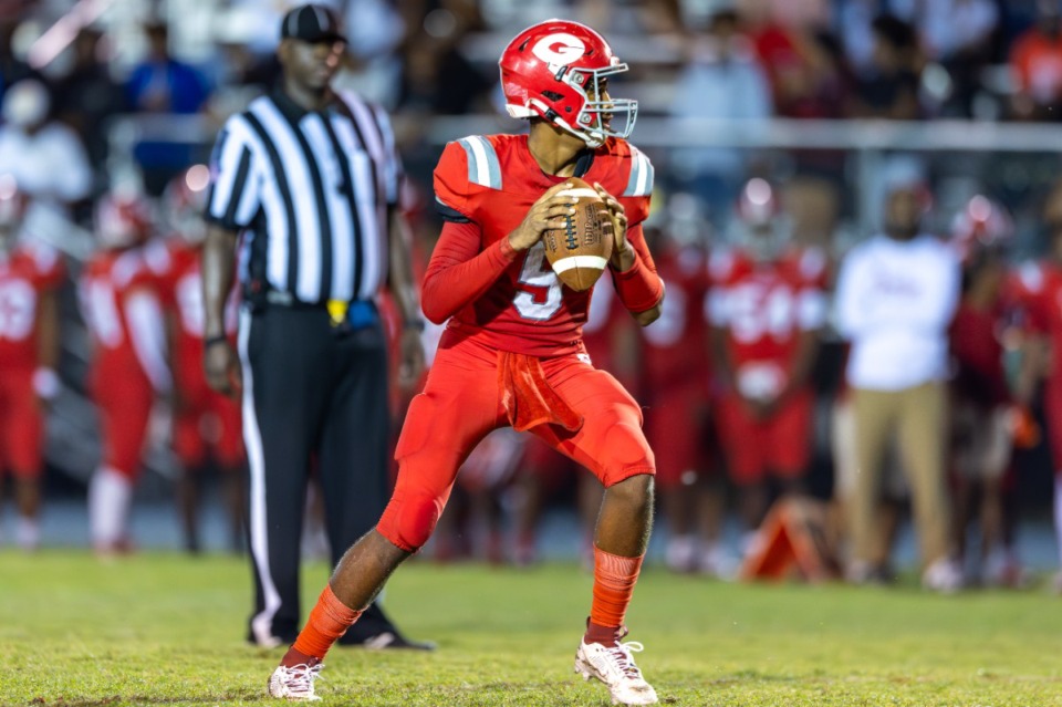 <strong>Quarterback Mekhi Robins #5 of the Germantown Red Devils looks to pass the ball during the game between Germantown High School and Houston High School on Friday, Sept. 6, 2024.</strong> (Wes Hale/Special to The Daily Memphian)