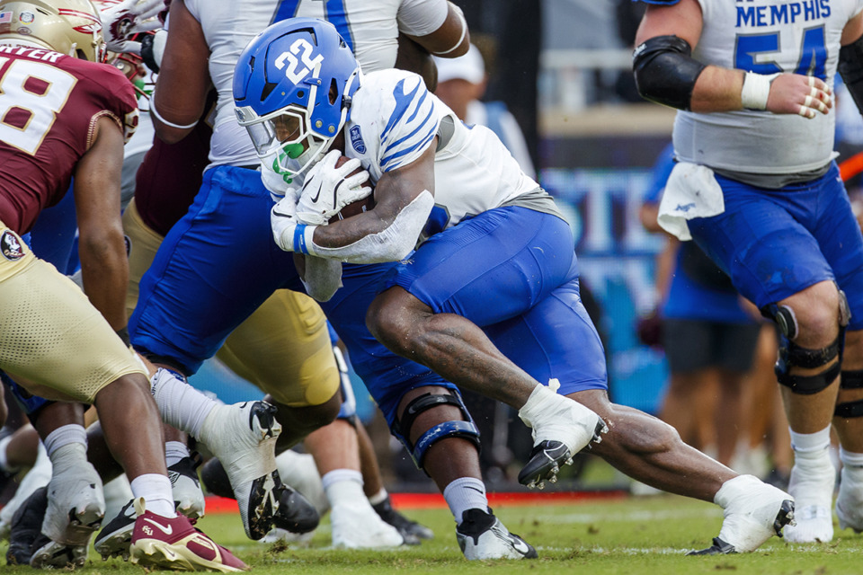 <strong>Memphis running back Brandon Thomas, 22, runs against Florida State during the first half of an NCAA college football game Sept. 14 in Tallahassee, Fla.</strong> (Colin Hackley/AP file)