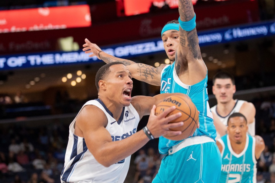 <strong>Memphis Grizzlies guard Desmond Bane (22) drives to the basket defended by Charlotte Hornets guard Tre Mann (23) Thursday, Oct. 10, 2024.</strong> (Nikki Boertman/AP)