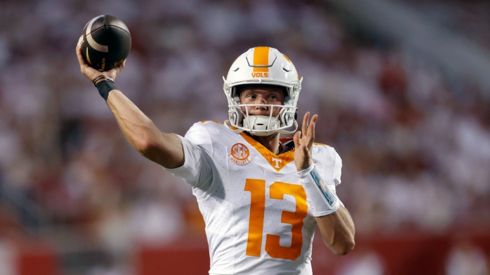 <strong>Tennessee quarterback Gaston Moore (13) warms up on the sideline during an NCAA football game against Arkansas on Saturday, Oct. 5, 2024, in Fayetteville, Ark. Arkansas won 19-14.</strong> (AP Photo/Mike Buscher)