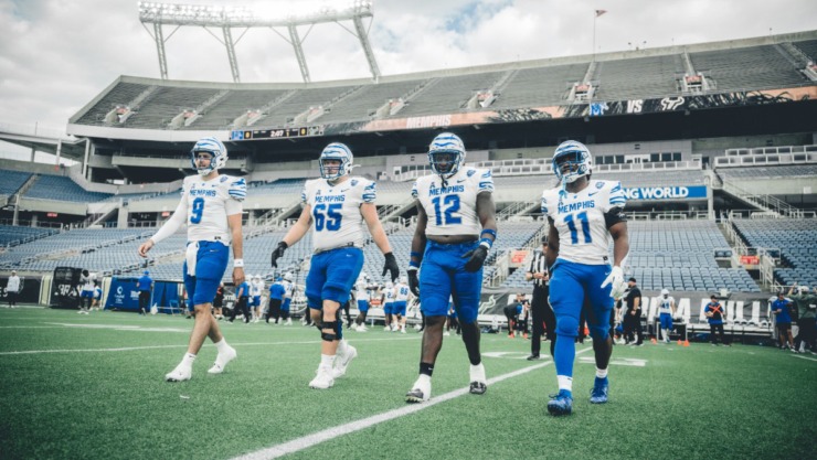 Memphis Tigers game captains, Seth Henigan (9), Jonah Gambill (65), Cormontae Hamilton (12) and Chandler Martin (11), walk out to meet the referee before the start of Saturday's game against USF at Camping World Stadium in Orlando, Fla.&nbsp;(Courtesy Memphis Athletics)