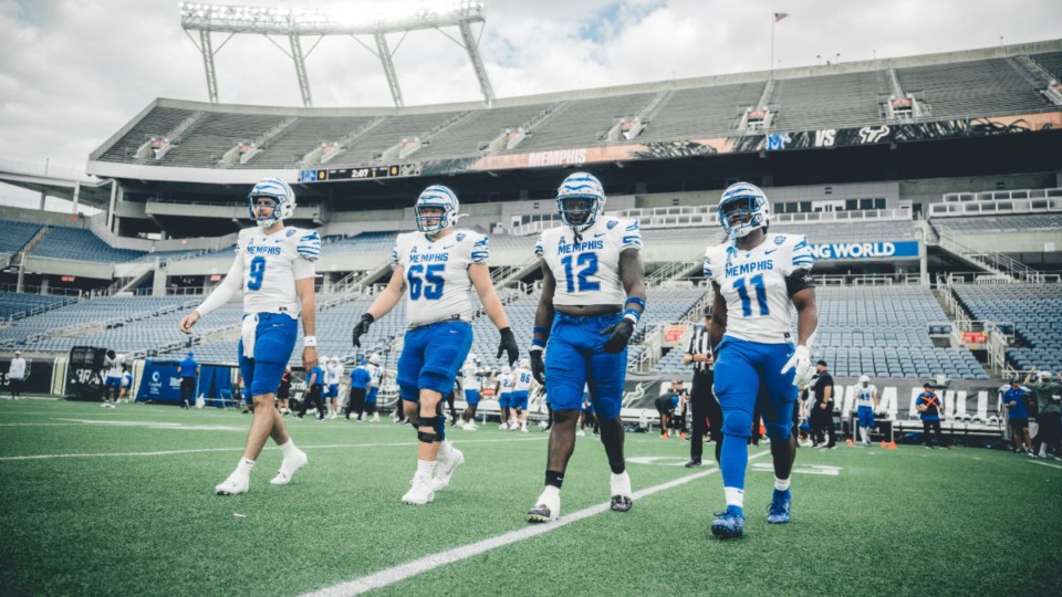 <strong>Memphis Tigers game captains, Seth Henigan (9), Jonah Gambill (65), Cormontae Hamilton (12) and Chandler Martin (11), walk out to meet the referee before the start of Saturday's game against USF at Camping World Stadium in Orlando, Fla.</strong>&nbsp;(Courtesy Memphis Athletics)