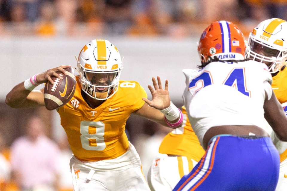 <strong>Tennessee quarterback Nico Iamaleava (8) tries to escape the grasp of Florida edge Kamran James (24) during the first half of an NCAA college football game, Saturday, Oct. 12, 2024, in Knoxville.</strong> (Wade Payne/AP)