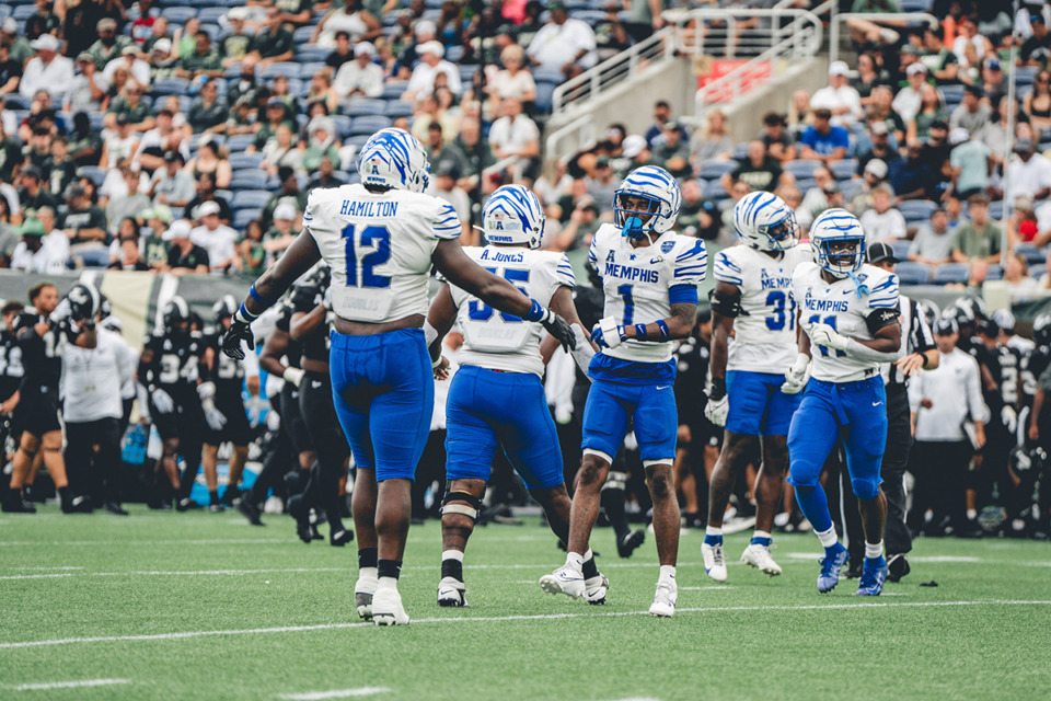 <strong>Memphis defenders Cormontae Hamilton (12) and Davion Ross (1) celebrate a successful defensive play against USF Saturday in Orlando, Fla.</strong> (Courtesy Memphis Athletics)