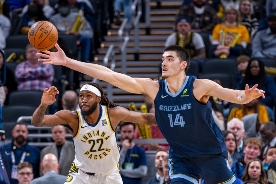 <strong>Memphis Grizzlies center Zach Edey (14) reaches for a rebound with Indiana Pacers forward Isaiah Jackson (22) in Indianapolis, Monday, Oct. 14, 2024.</strong> (Doug McSchooler/AP)