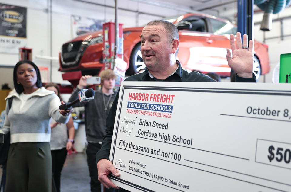 <strong>Cordova High automotive teacher Brian Sneed receives a $50,000 prize recognizing excellence in skilled-trades education from Harbor Freight Oct. 15.</strong> (Patrick Lantrip/The Daily Memphian)